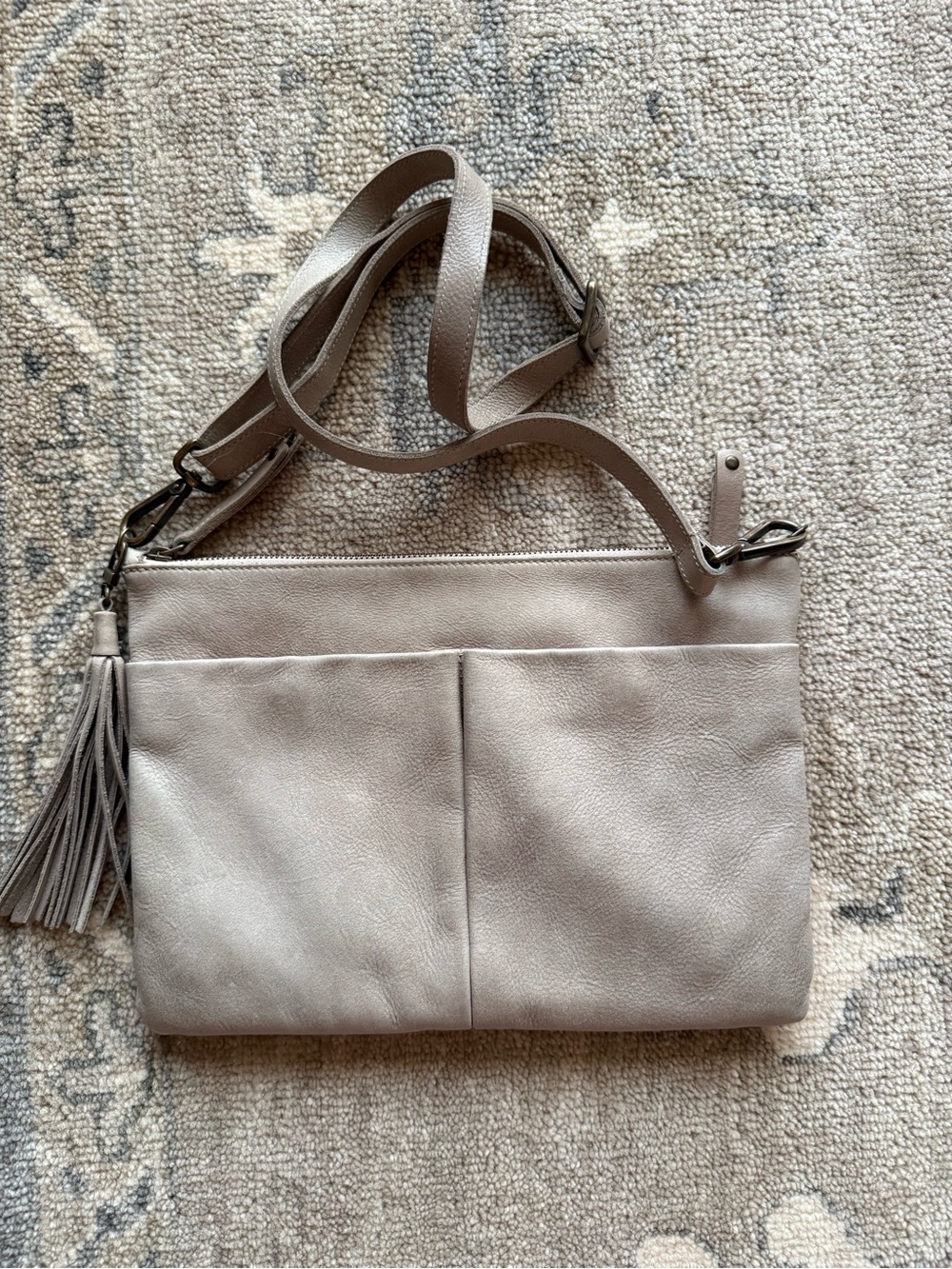 Roots Taupe Leather Crossbody with Tassel